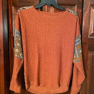 Burnt orange Maurice’s sweater